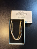 Gold tone and faux pearl necklace